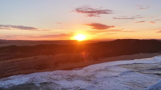 Gibson Steps and Port Campbell National Park, Great Ocean Road, Victoria, Australia at sunrise: 4K aerial drone footage of cliffs, beach, ocean waves and coastal landscape near Twelve Apostles.