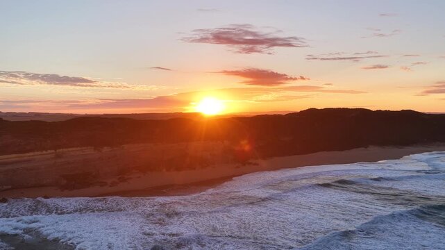 Gibson Steps and Port Campbell National Park, Great Ocean Road, Victoria, Australia at sunrise: 4K aerial drone footage of cliffs, beach, ocean waves and coastal landscape near Twelve Apostles.