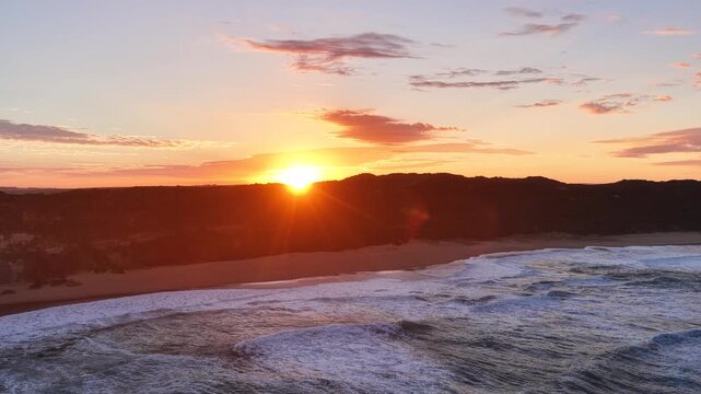 Gibson Steps and Port Campbell National Park, Great Ocean Road, Victoria, Australia at sunrise: 4K aerial drone footage of cliffs, beach, ocean waves and coastal landscape near Twelve Apostles.