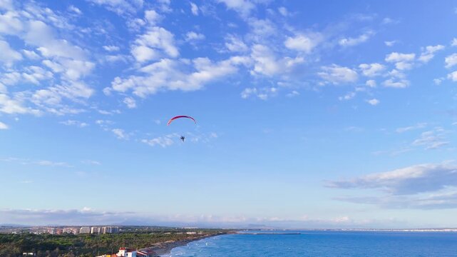 paragliding vacation hobby travel sport summer blue sky minimal design commercial business communication flying tourism landscape sea beach coast - Guardamar del Segura, Alicante, Spain - 2025