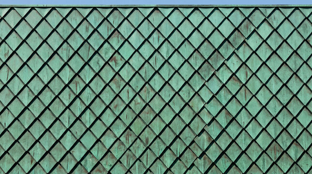 Modernist Building Facade with Angled Patinated Green Copper Shingles