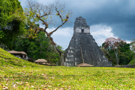 Mayan temple of the Grand Jaguar (Temple I) with dramatic clouds, Tikal, Guatemala.