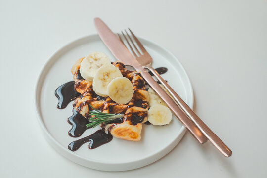 Delicious chocolate banana waffles kitchen table food photography cozy atmosphere close-up