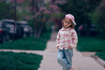 Fototapeta premium little girl walking in the park