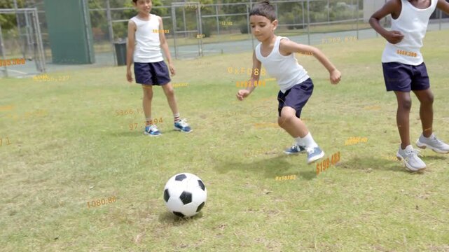 Center boy controlling, dribbling ball after right boy tackle in soccer drill with orange $ overlay