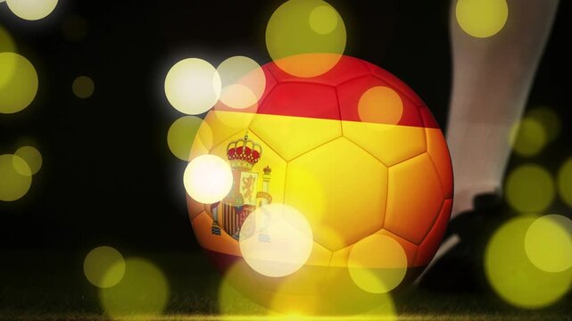 Spanish soccer ball rolling after player cleat touching ball, advancing, bokeh lights washing scene