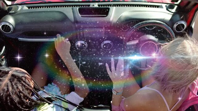 Driver and pal mirroring in car, sun beaming and rainbow flares sparkling hands, smiling for travel