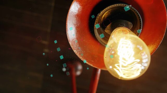 Camera zooming in, lamp filament brightening, cyan squares drifting, highlighting worn red shade