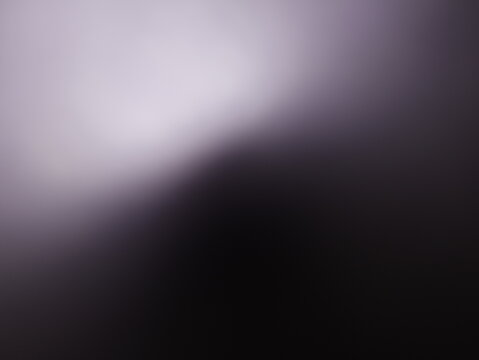 Una toma de cerca de un fondo abstracto de un color gris con negro con un degradado ligero desenfocado