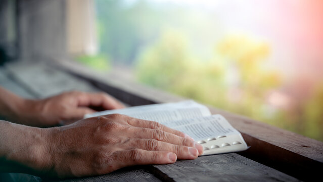 Close up of a man reading the Bible Spiritual concepts by studying the Holy Scriptures together, devotional concept