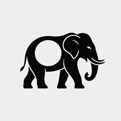 Fototapeta premium Stylized black silhouette of an elephant with a circular void