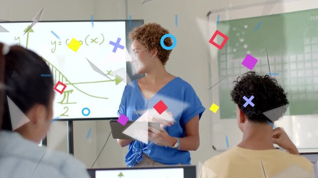 Teacher leading math, pointing at cosine graph, initiating shapes over devices, clarifying curve