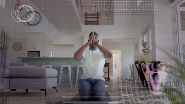 Man kneeling mat raising palms up lowering hands starting meditation with glitch overlay around man