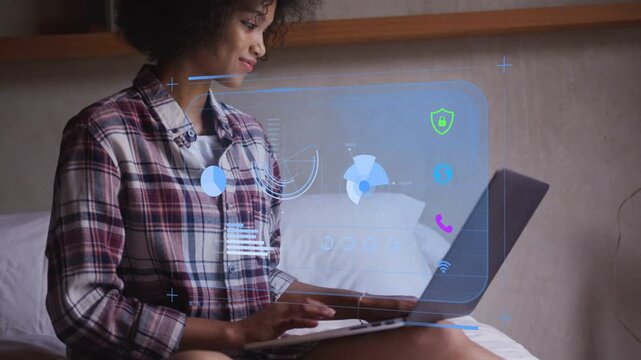 Woman typing on laptop, activating HUD with pie chart and shield, joining remote work call, waving