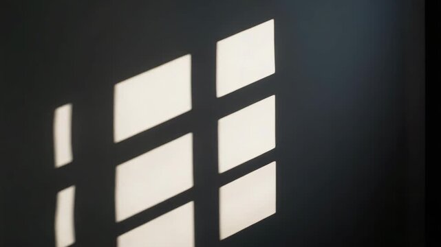 Sunlit window grid shadow on wall with soft geometric pattern, calm light and mood