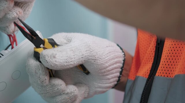 Smart Home: Technician is replacing old light switch with a modern switch, touch or smart phone-controlled on-off light. Capacitive touch switch to control room lighting.