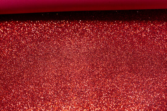 Red glitter foam sheet texture. Shimmering background for Christmas, Valentine's Day and crafts.