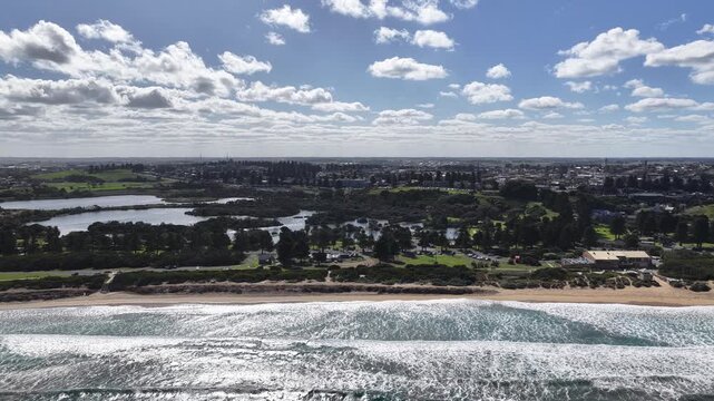 Warrnambool, Victoria, Australia: 4K aerial drone footage of coastal town, sandy beaches, ocean waves, wetlands, E Johnson Reserve, river inlets and urban landscape with houses, shops and streets