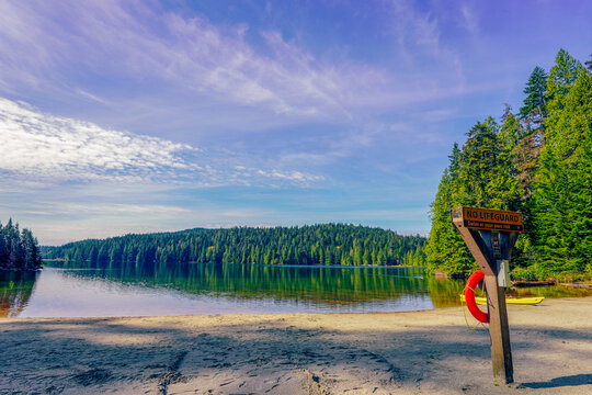 Deserted beach by a BC fresh water lake in early Spring.