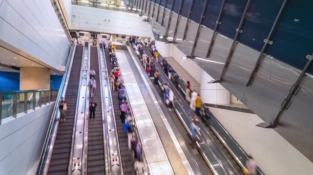 Subway people travelling on escalators. Timelapse.
People traveling up and down through multiple escalators in a subway train station.
