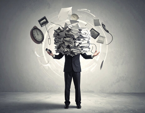 Man juggling papers and documents