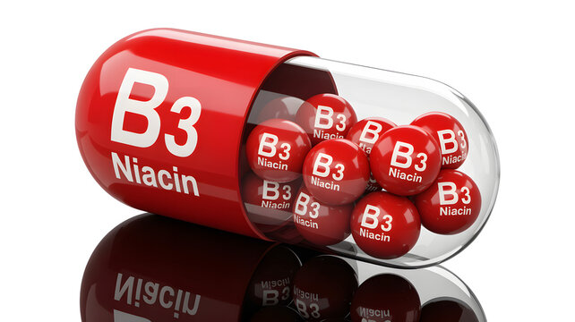 A red vitamin B3 Niacin capsule with smaller pills inside  