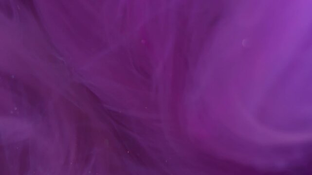 Vertical video. Cloud mix. Defocused ink stream. Sparkling mist purple color liquid swirl flow. Art shimmering vapor whirl abstract background texture.