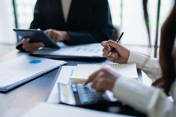 Asian businesswomen planning strategy in corporate meeting for business growth © Charlie's