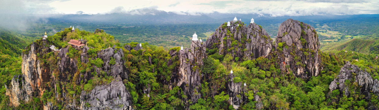 Panoramic aerial view of Small white pagodas are perched on the high mountains,