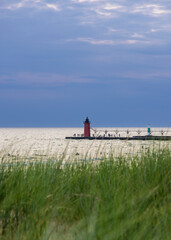 Fototapeta premium South Haven Lighthouse and pier on Lake Michigan at sunset