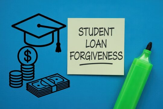 Student Loan Forgiveness Concept on Sticky Note with Graduation Cap and Money Drawing on Blue Background
