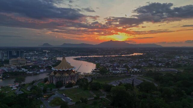 Kuching, Sarawak Malaysia - April 19 2026 : Stunning aerial view of Kuching at sunset, featuring the iconic Sarawak State Legislative Assembly building and the Sarawak River. 