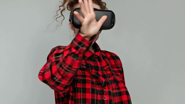 4K Woman, virtual reality headset, Young woman dancing and interacting with virtual reality headset in a modern indoor setting, dancing, interacting, hand movements, indoor, studio, modern