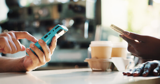 Hands, barista and pos machine with phone in cafe for customer service or wireless transaction. People, cashier or banking app with NFC system or smartphone for checkout or payment in coffee shop