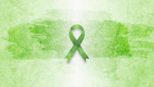 Green awareness ribbon symbol for mental health, lymphoma, or liver cancer awareness on grunge watercolor blots abstract background. Healthcare motion design. Video animation Ultra HD 4K 3840x2160