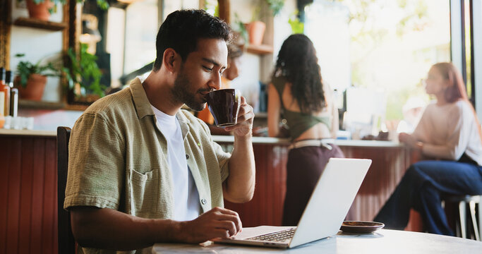 Creative, man and coffee with laptop at cafe for remote work, proofreading and editor feedback. Freelancer, beverage and editing article with pc, copywriting report and confirm source for publication
