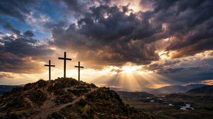 Obraz premium Three wooden crosses on a hill at sunset for Good Friday and Easter