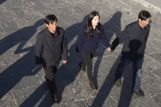 group of people walking on street