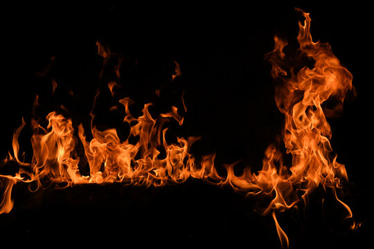 Texture of fire on a black background. Abstract fire flame background, large burning fire.
