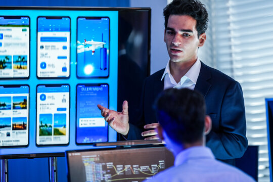 Professional strategy session in a modern office, planning an AI application roadmap and marketing concept on a glass board at night. Tech innovation teamwork.