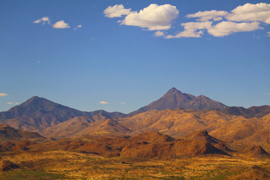 Majestic Mountain Range Under Blue Sky