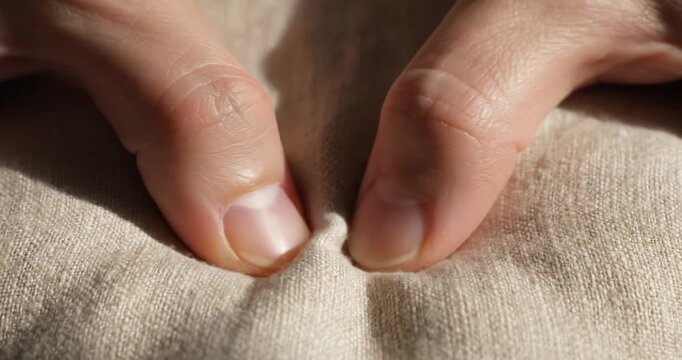 Fingers Touching Fabric with Fingertips Closeup.