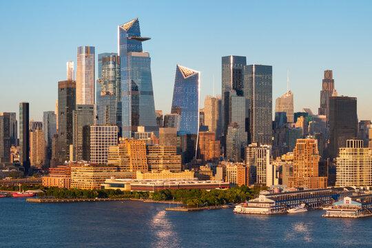 Aerial New York City view of Midtown Manhattan skyline, with Hudson Yards skyscrapers, Hudson River waterfront and Chelsea piers