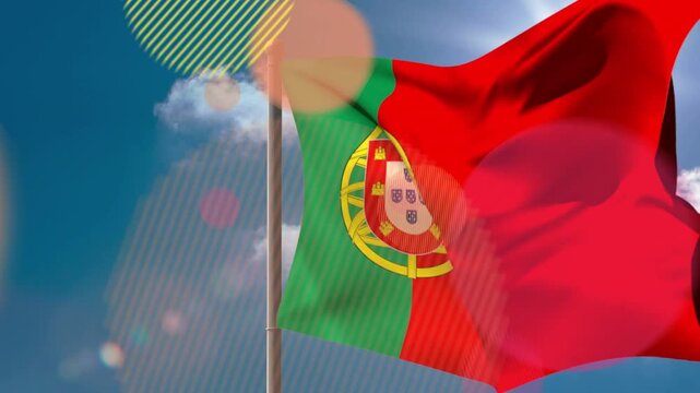 Gusts of wind causing Portugal flag to unfurl and ripple, revealing coat of arms