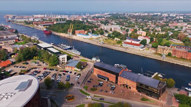 Golden light over Liepaja Latvia harbor streets cranes and city skyline