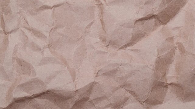 Stop motion of crumpled craft brown paper texture, abstract loop background