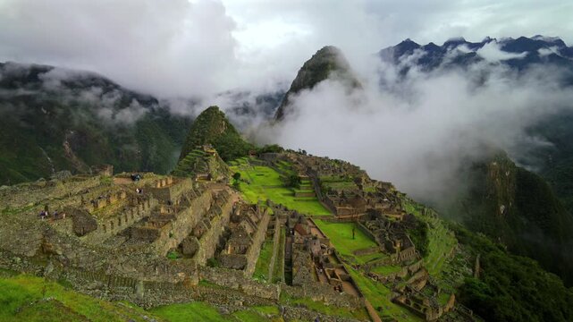 Peru's famous Machu Picchu World heritage site sanctuary Inca Temple early morning landscape view low cloud fog layer Huayna Picchu Mountain Inca Trail Aguas Calientes  Peruvian Andres Mountains