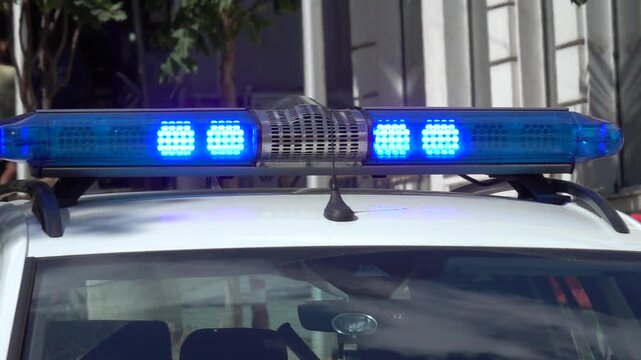 Blue flashing warning light. Close up flash on police car sign. siren light