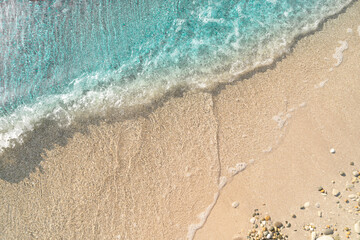 Obraz premium Wave on sand beach with copy space 