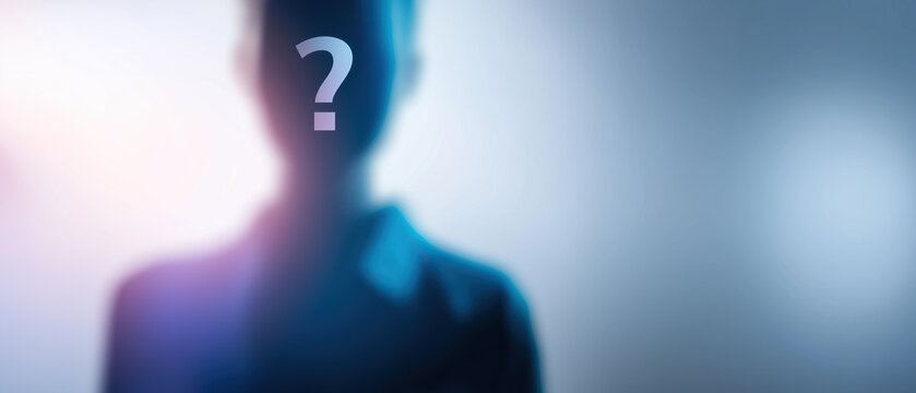 Blurred mysterious human silhouette with glowing question mark symbolizing identity, anonymity, unknown person.